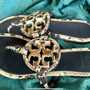 Tory Burch Gold and Black Sandals with Baroque Elegance